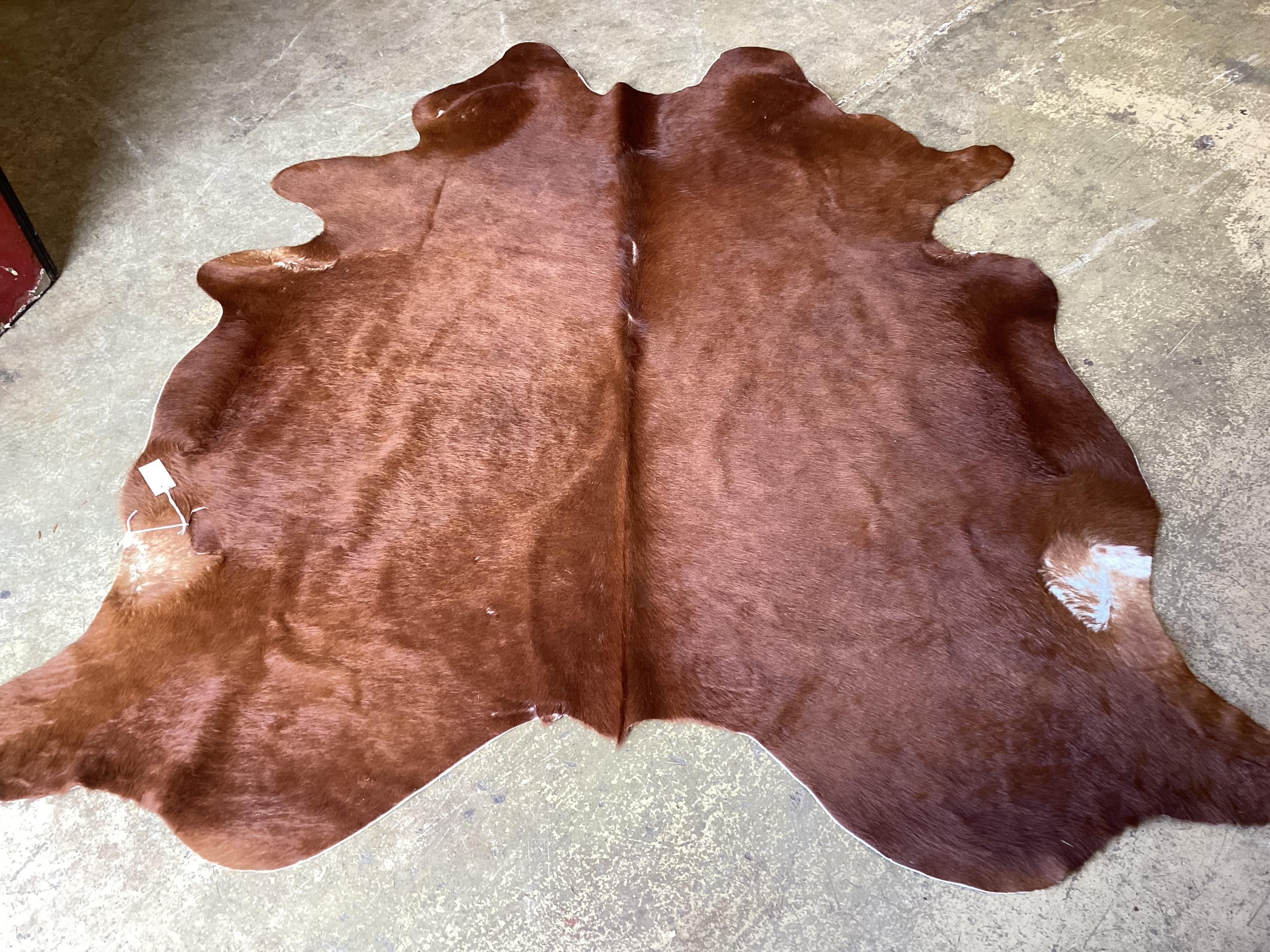A cow skin rug, approx. 180 x 160cm